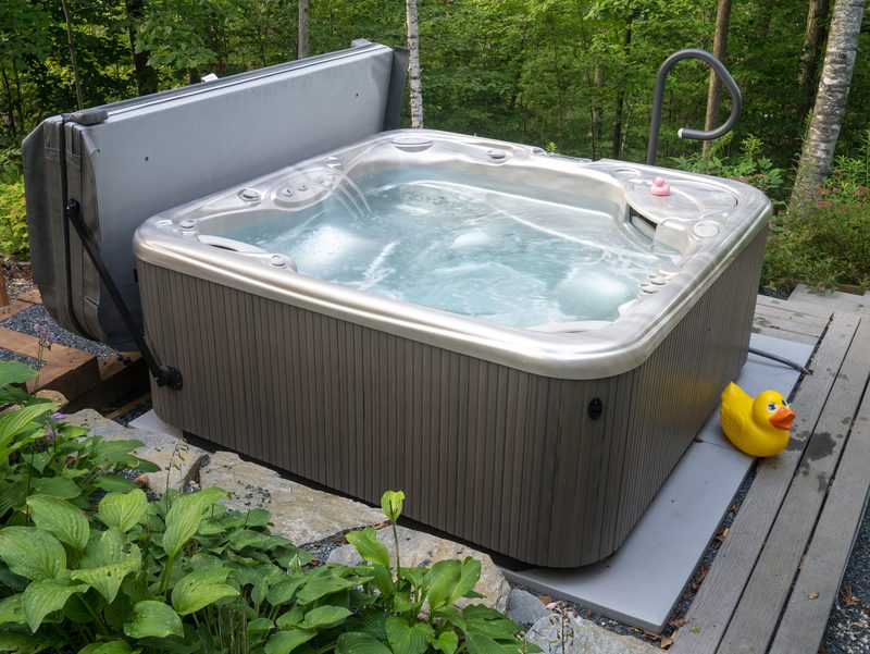 Hot tub in backyard ready for professional moving service