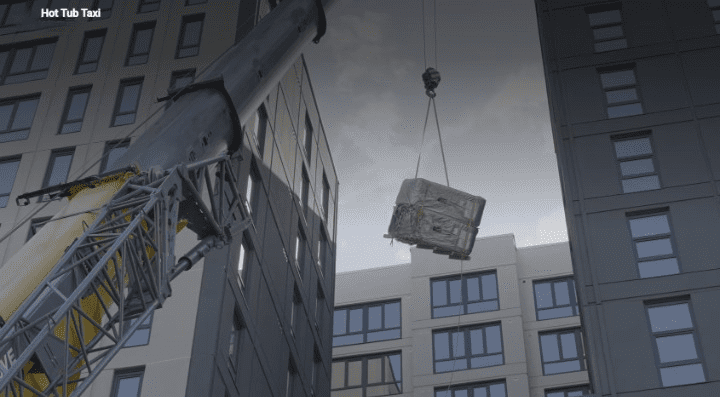crane lifting a hot tub